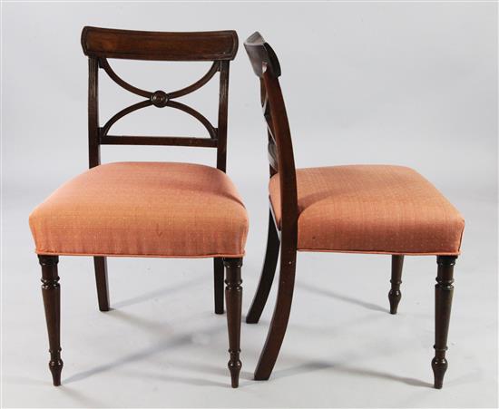 A set of six early 19th century mahogany dining chairs,